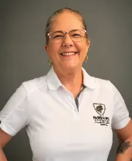 Michele Howard, account manager at Fairbanks Insurance, smiling in a Fairbanks Insurance polo