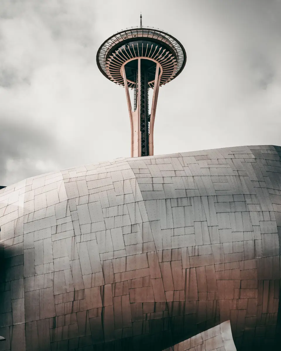Space Needle in Seattle rising above the Museum of Pop Culture